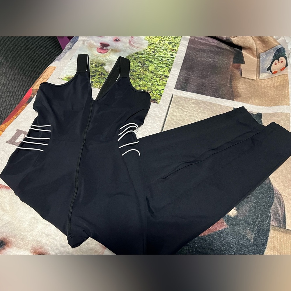 Cushnie Active black jumpsuit with white elastic piping to accentuate the waist
